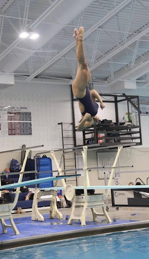 Greeley West junior Londyn Daniel twists in the air during a dive earlier in the season.  Daniel has already qualified for state in February.  