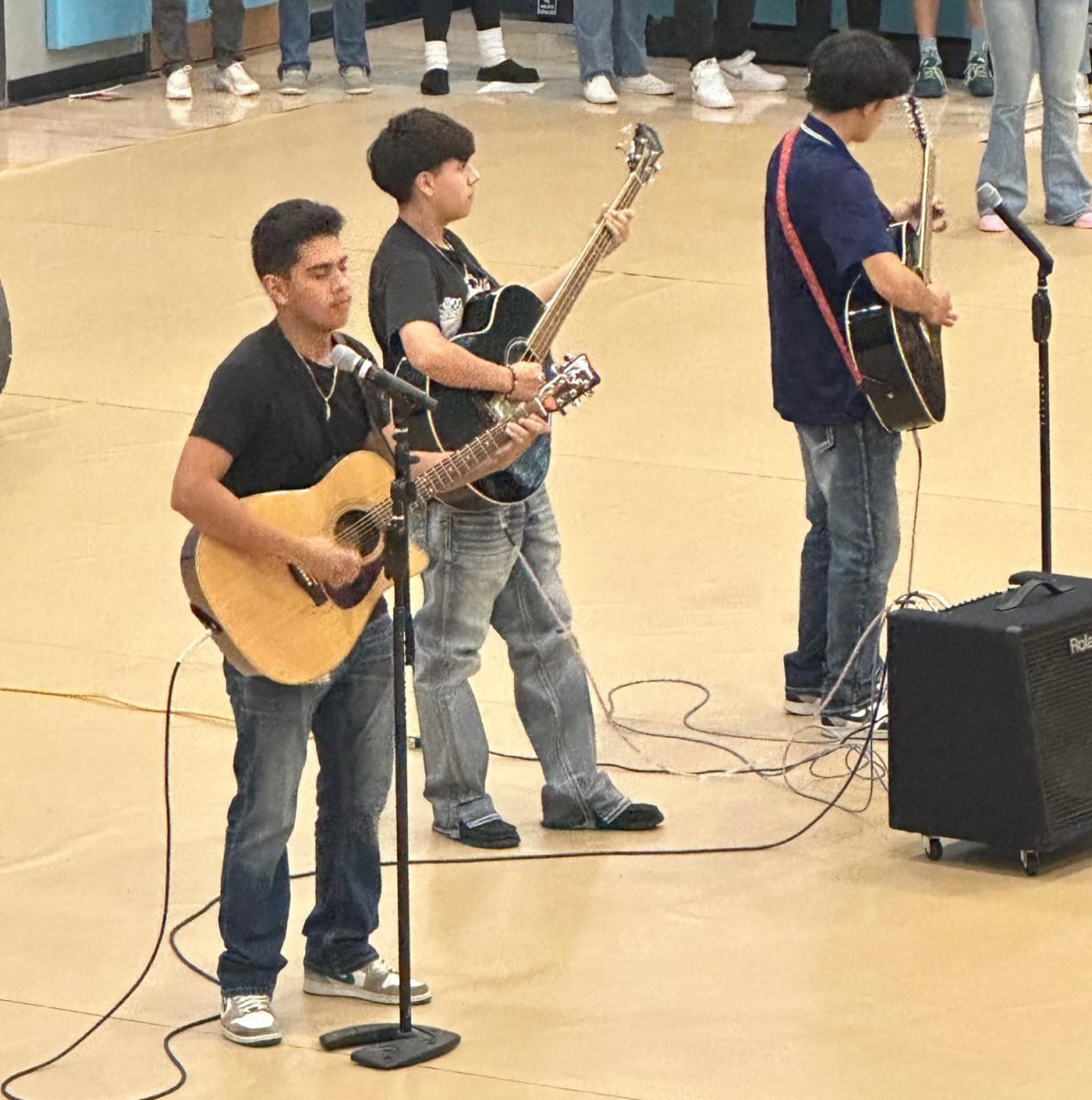 Greeley West students Edgar Garcia, Leo Soto, and Kevin Hererra play a song in front of the assembly last week.