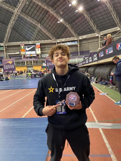 Julian Chavez shows off his hardware in Iowa.  