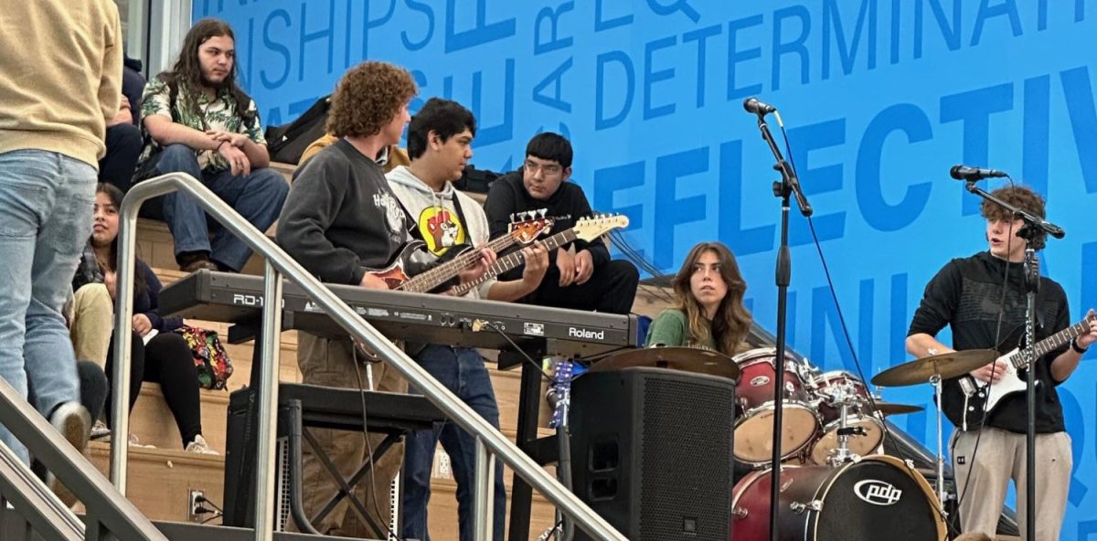 Greeley West students Jeremy Keenrer, Herin Merino, Lena Martinez and Landyn Nickell rock out during the Battle of the Bands last Friday in the commons.