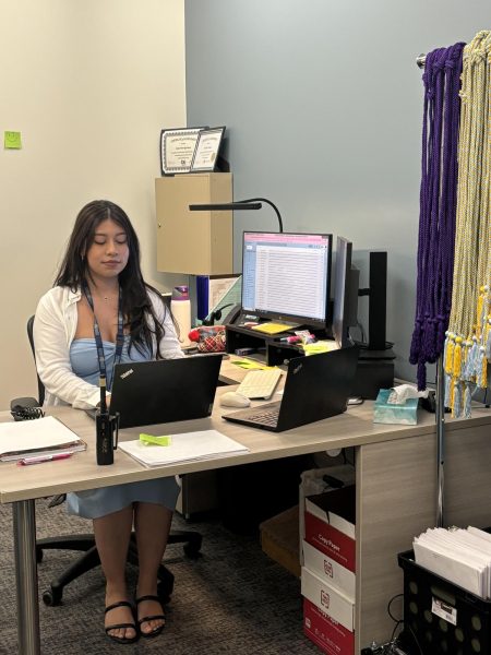 Jessica Torres Martinez adjusts to her new office at Greeley West.  Torres Martinez is Wests new Office Manager.
