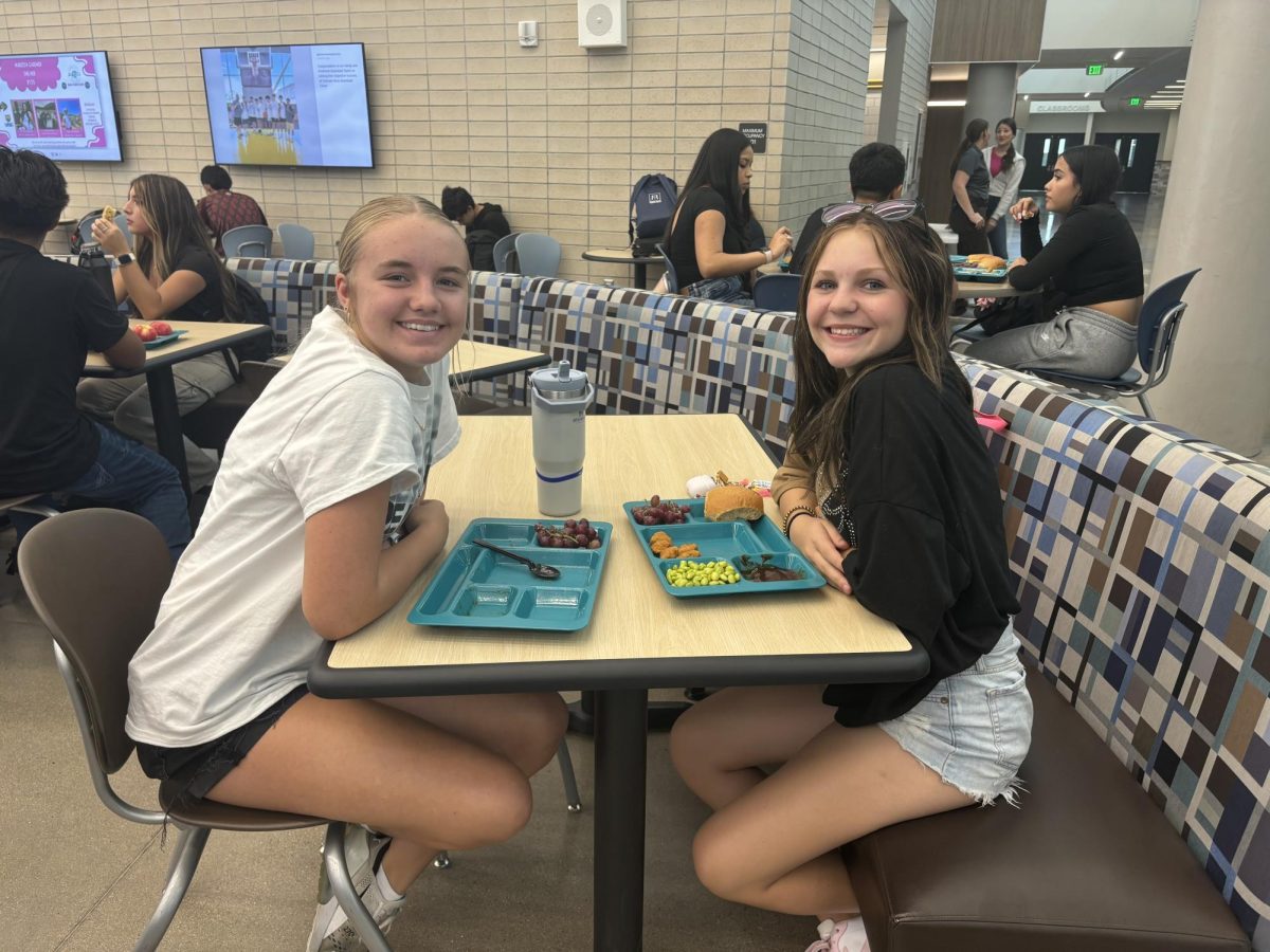 Greeley West freshmen Keelee Becher and Hailey Hout enjoy lunch together.  