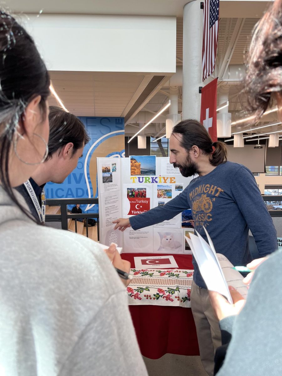 Oncu Yaylagui, a teacher from Turkiye, presents to students about his experience as a teacher in Europe.