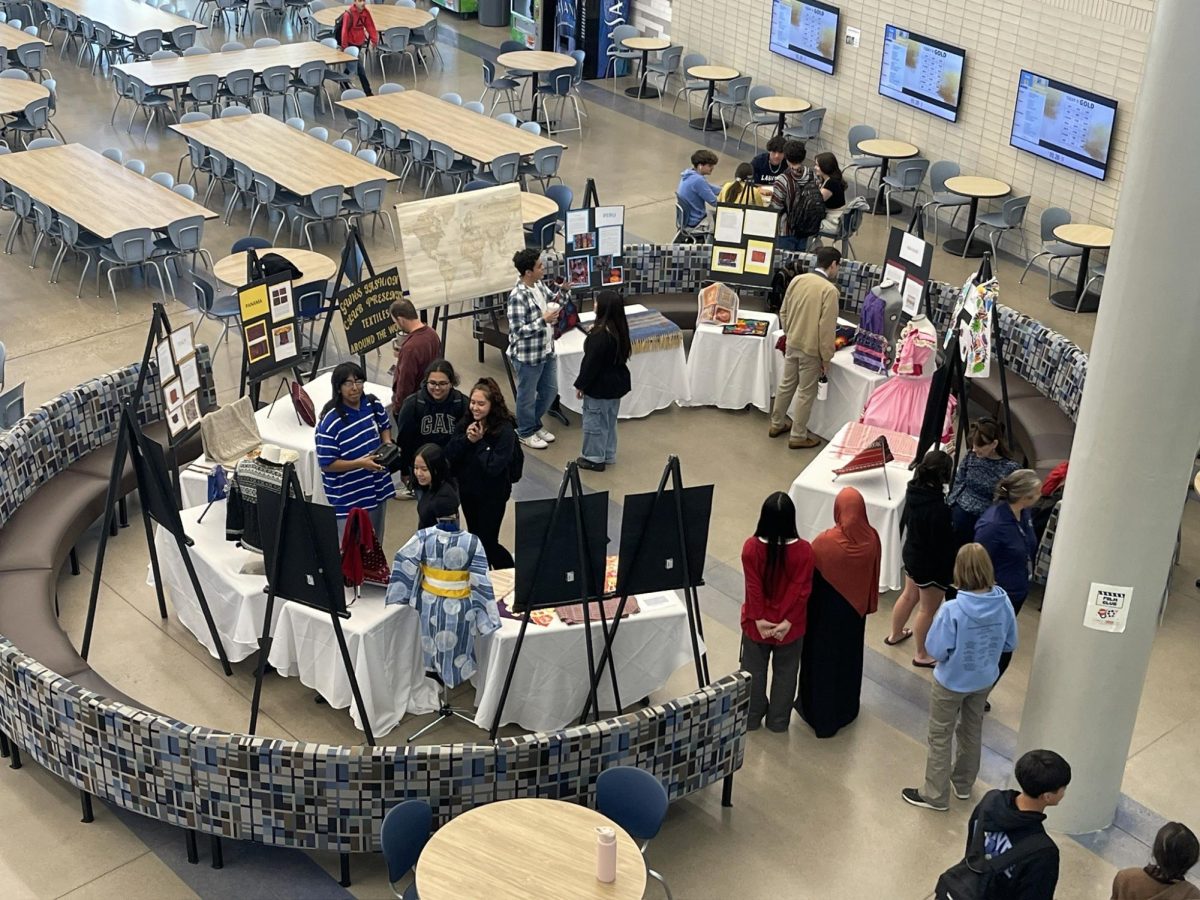 The Greeley West Fashion Club shares textiles from around the world in the commons on Wednesday.  