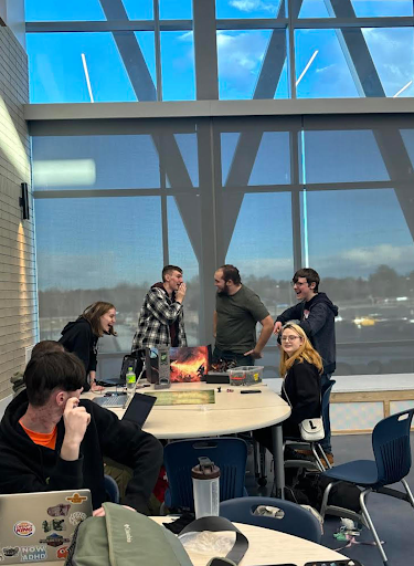 Greeley West students _____ and _______ share a laugh during Dungeons and Dragons club last week. 