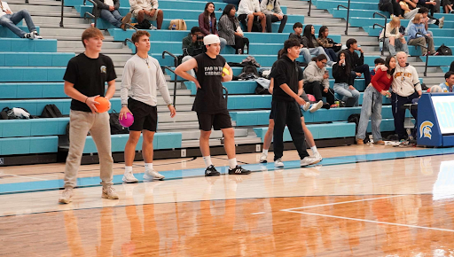 Tagen Becher surveys the scene while Jedediah Hicks and Jeremiah Duhring look on at Wedenesday's dodgeball tournament. 