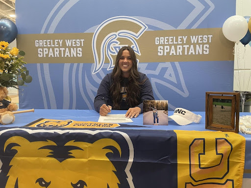 Ellyse Hydock poses for photos after signing her letter of intent at the University of Northern Colorado.