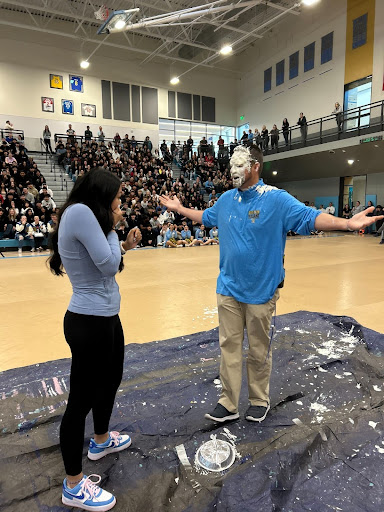 Principal Jeff Cranson receives a pie in the face during Thursday's assembly.  