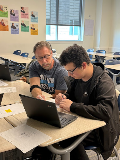 Mr. Jason Renouf works with freshman Lazarus Guajardo on Friday morning.
