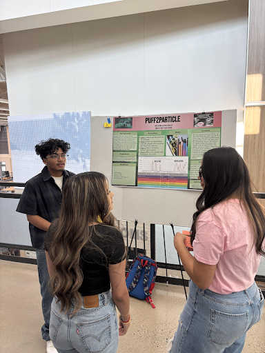 Greeley West junior Moe Nasim shares his findings about air quality during the annual symposium on Friday.