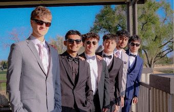 Foreign exchange student Samuele Lenzetti poses for a Prom picture with some of the friends he made while here.  Lenzetti said the closeness of American students was something he enjoyed while being here.